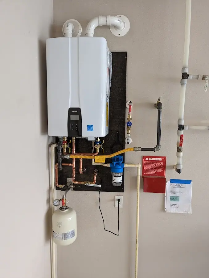 Professional plumber installing copper piping in a City of Orange home